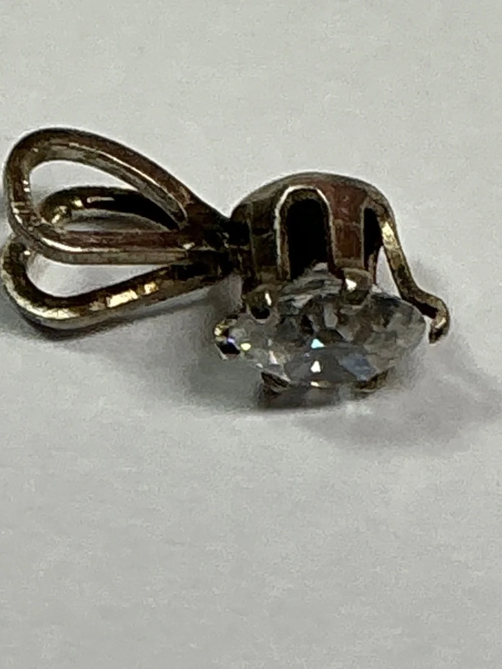 Sterling Silver Petite Pendant with a clear stone. 1/2 inches long